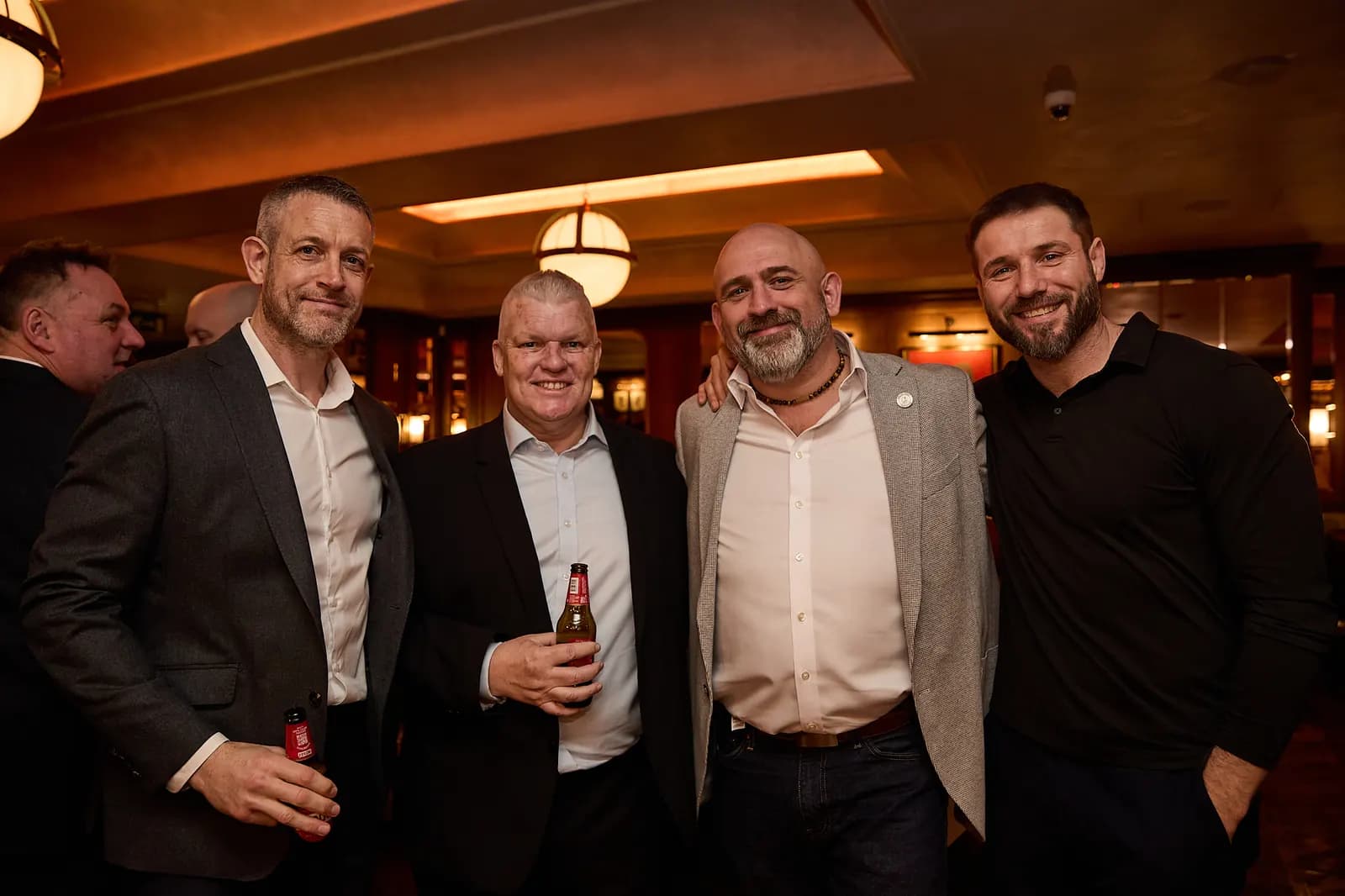Four guests together at the drinks reception